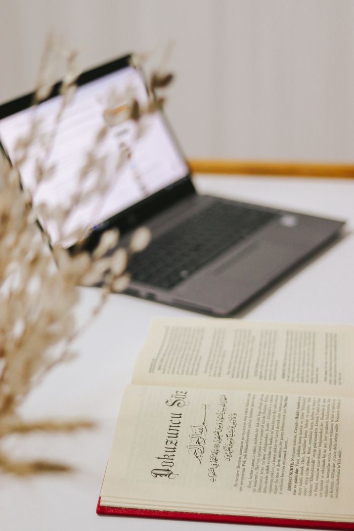 Mastering the First Impression: Your intriguing post title goes here A serene minimalist workspace featuring an open book and laptop, perfect for studying or working.